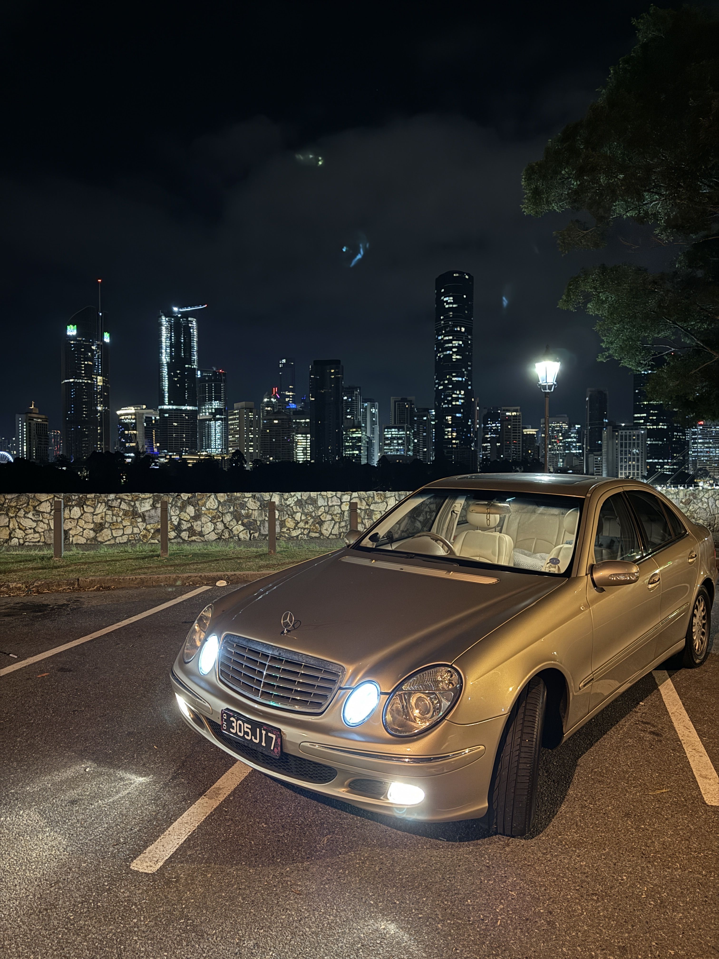 Claire parked at Kangaroo Point, Brisbane city in the background